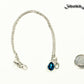 Small Personalized December Birthstone Choker Necklace beside a dime.