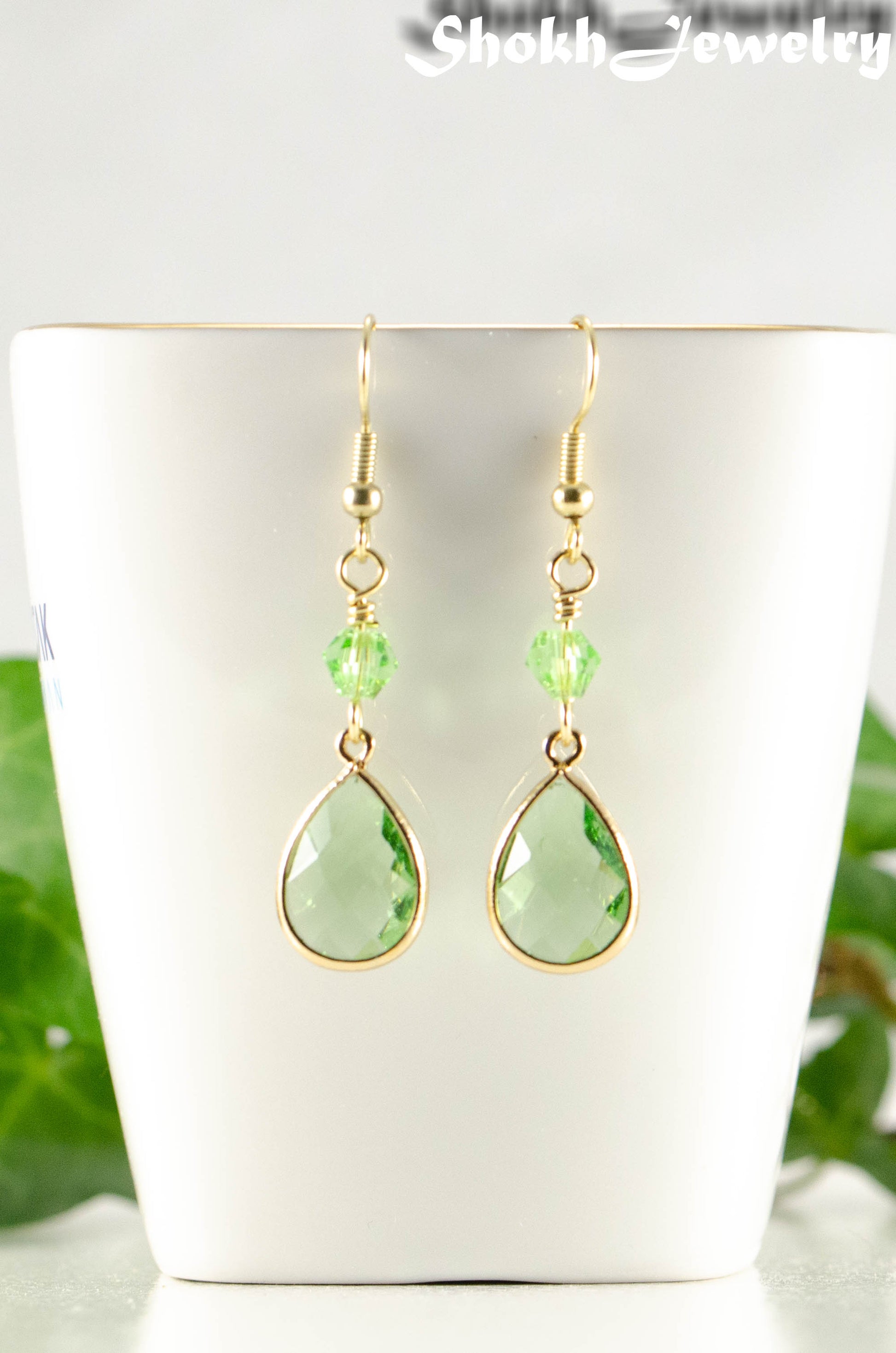 Close up for Green Glass Teardrop Dangle Earrings.