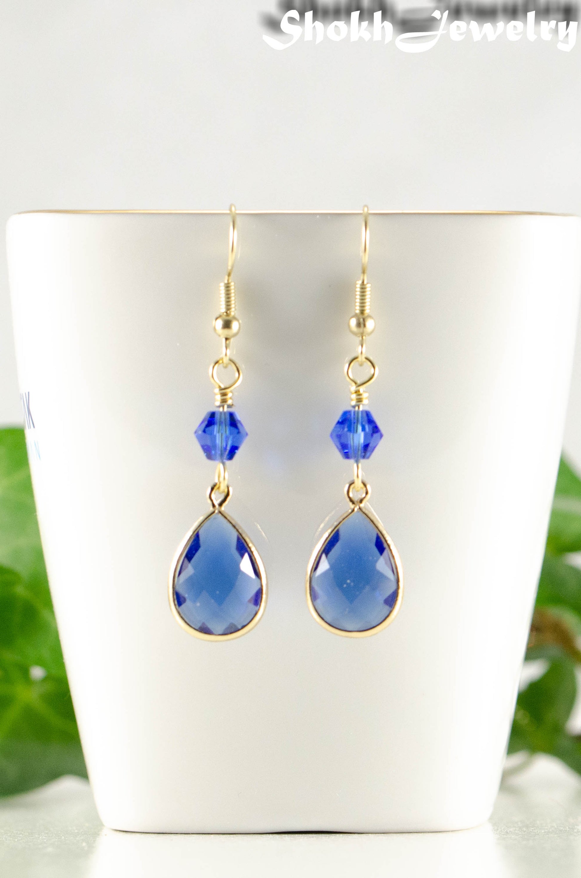 Close up of Blue Glass Teardrop Dangle Earrings.