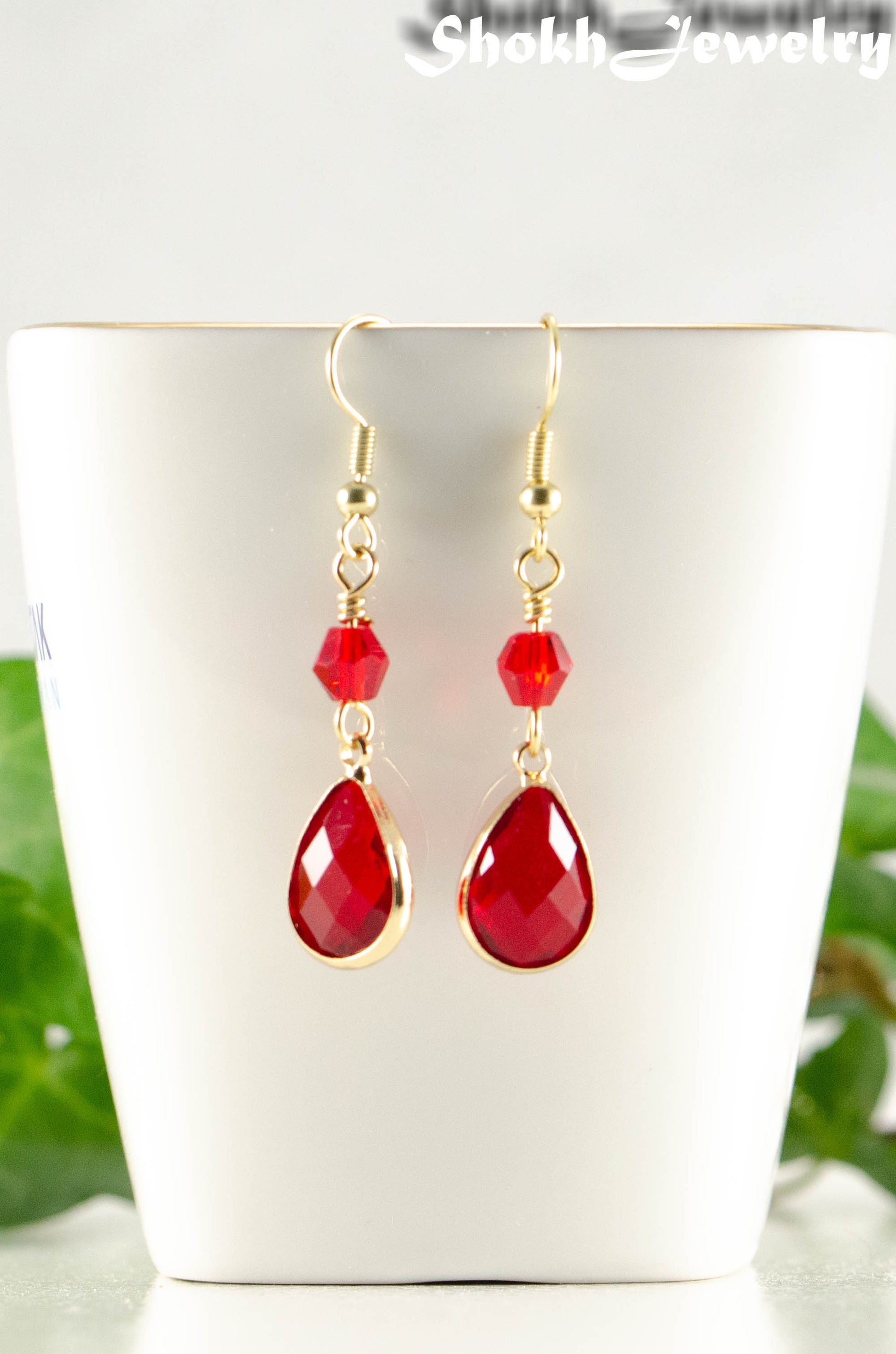 Close up of Red Glass Teardrop Dangle Earrings.