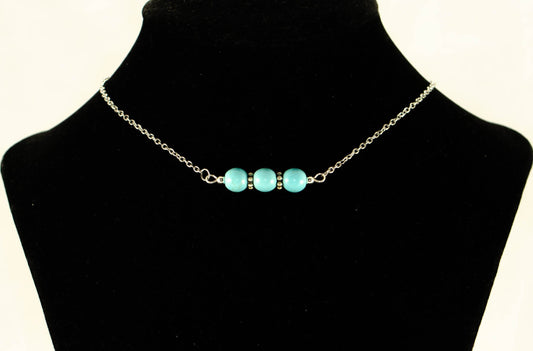 Turquoise Howlite and Dainty Chain Choker Necklace displayed on a bust.