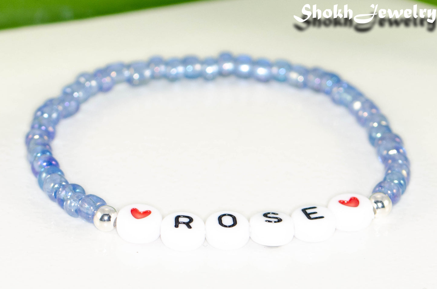 Close up of Blue Seed Beads Name Bracelet.