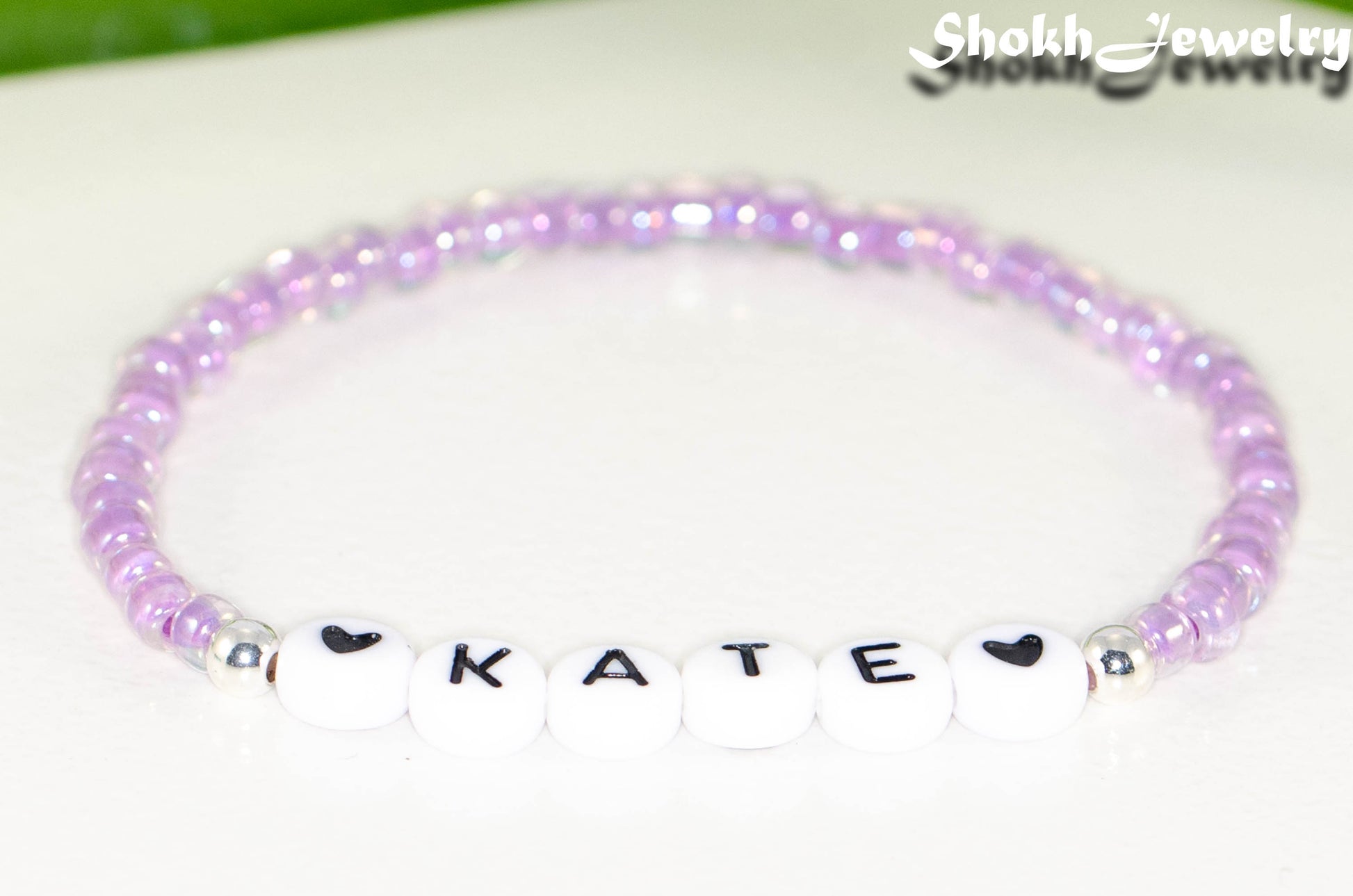 Close up of Purple Seed Beads Name Bracelet.