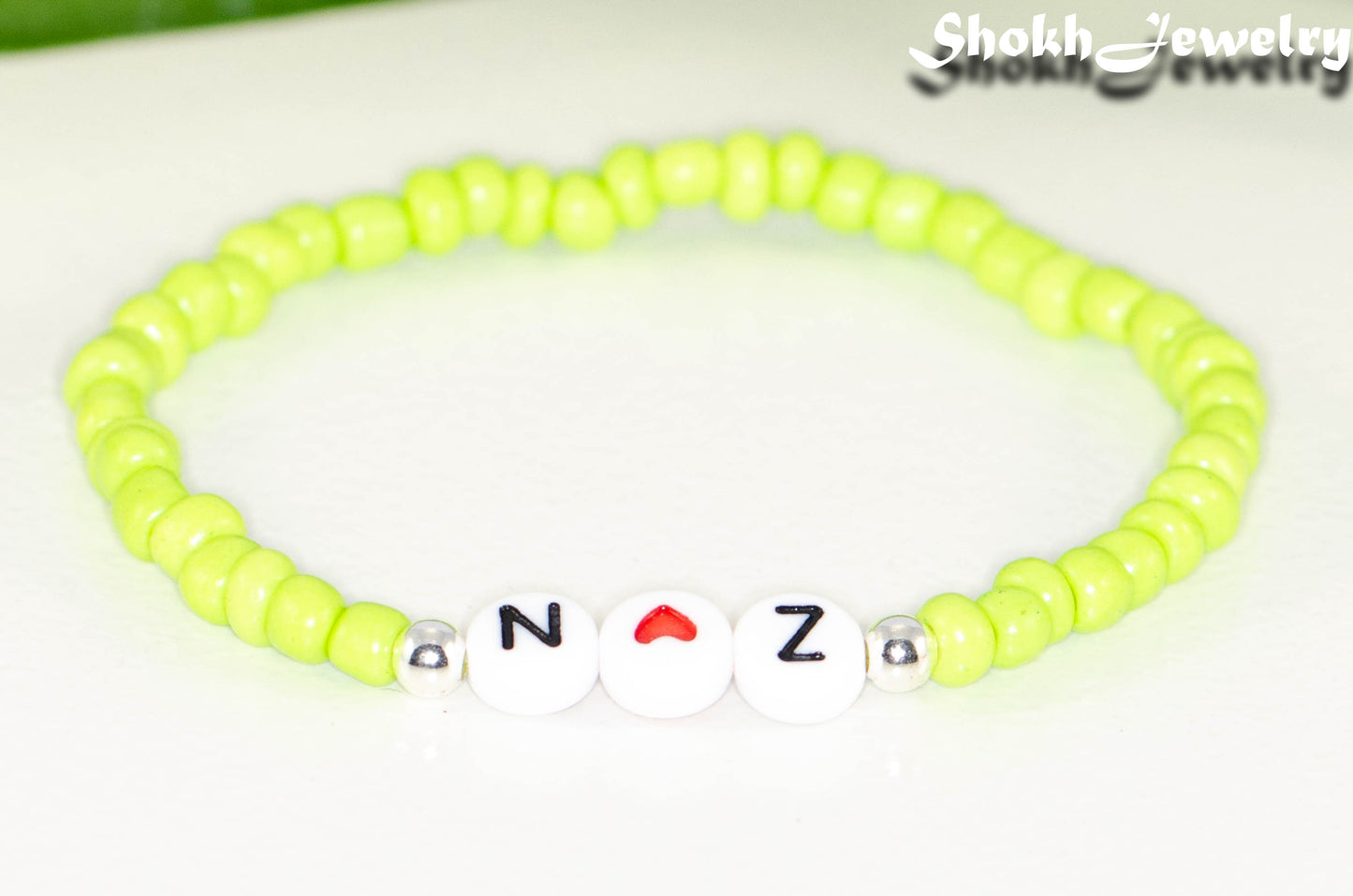 Close up of Lime Green Seed Beads Bracelet with Initials.
