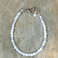 Top view of 4mm White Opal anklet with Clasp.