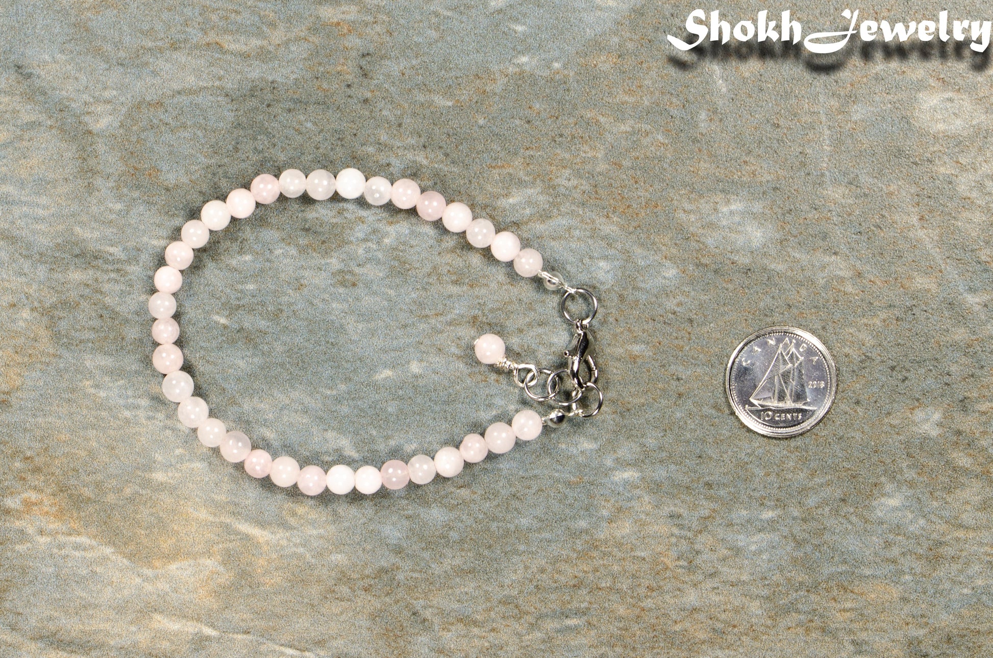 4mm Rose Quartz anklet with Clasp beside a dime.