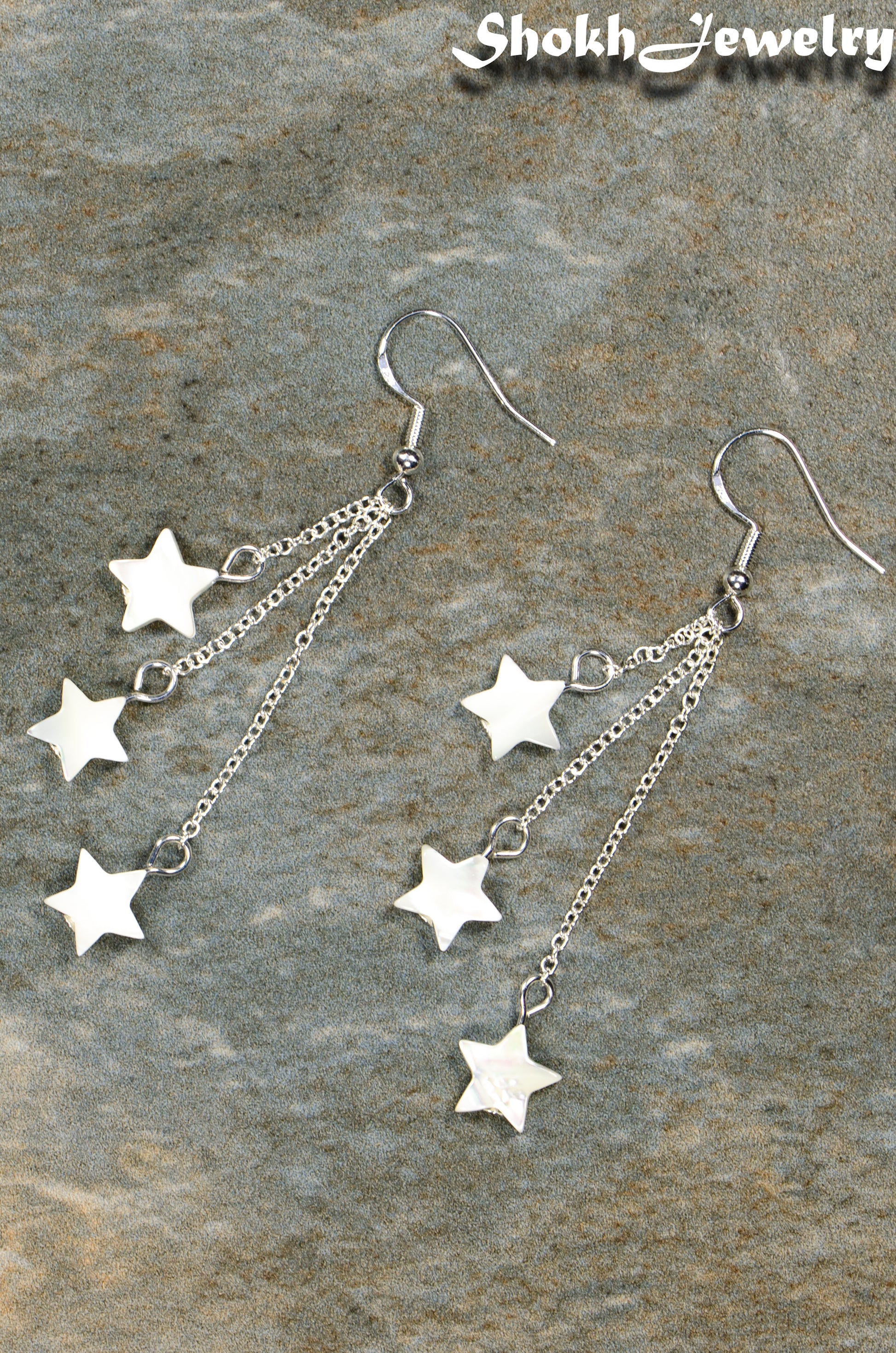 Top view of Long Silver Plated Chain and Seashell Star Earrings.