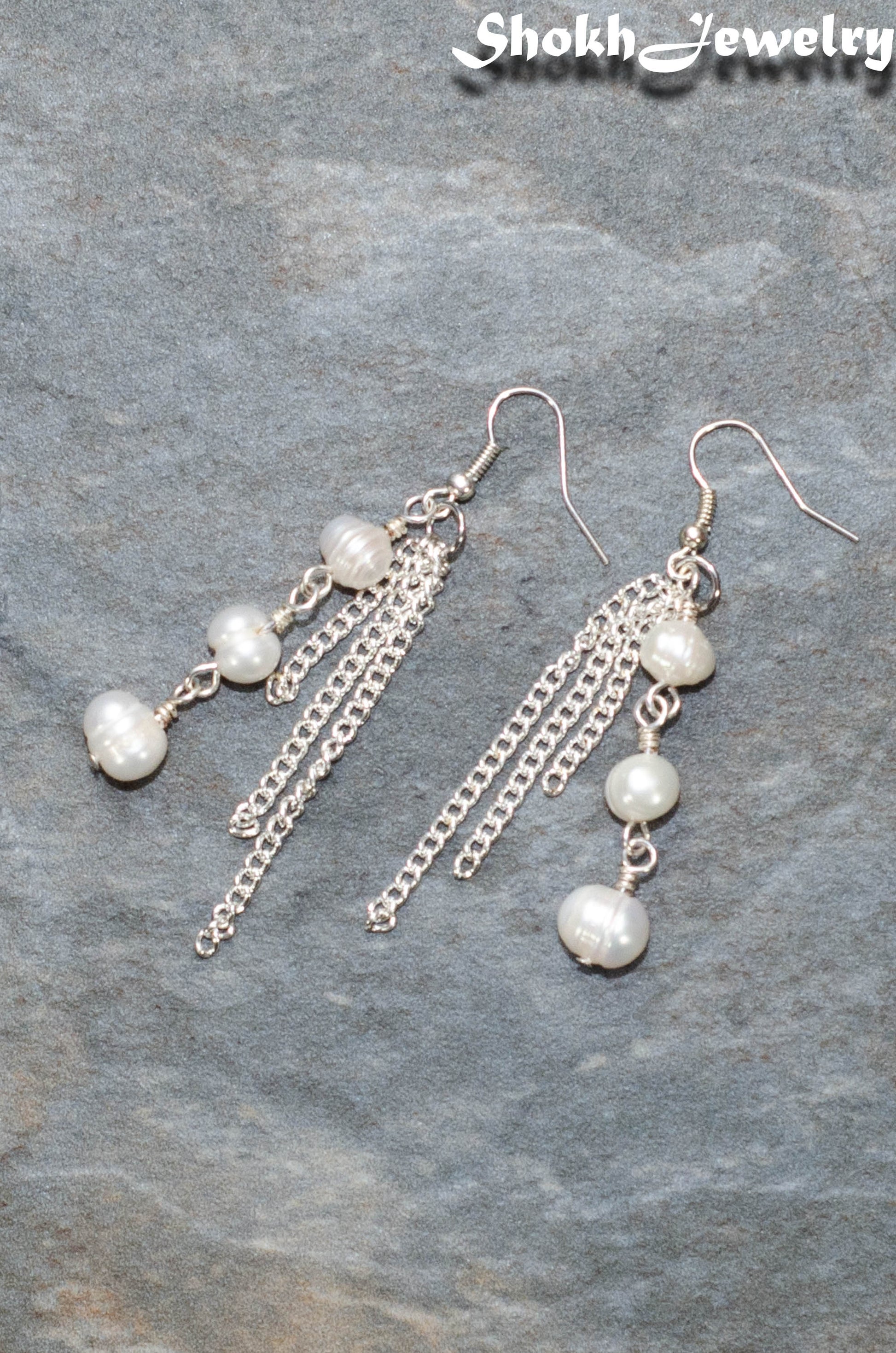 Top view of Long Chain and Freshwater Pearls Earrings.