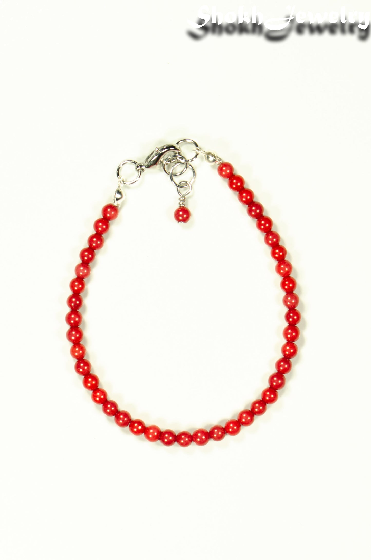 Top view of 4mm Natural Red Coral anklet with Clasp.