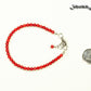 4mm Natural Red Coral anklet with Clasp beside a dime.