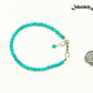 4mm Turquoise Stone anklet with Clasp beside a dime.