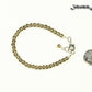 4mm Smoky Quartz anklet with Clasp beside a dime.