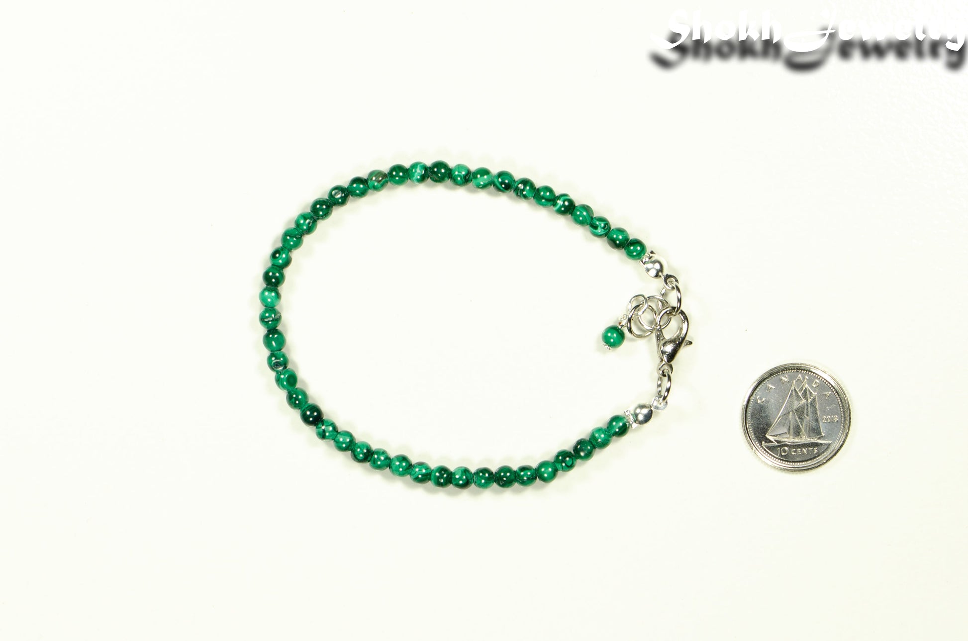 3mm Natural Malachite anklet with Clasp beside a dime.