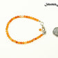 4mm Carnelian Crystal Anklet with Clasp beside a dime.