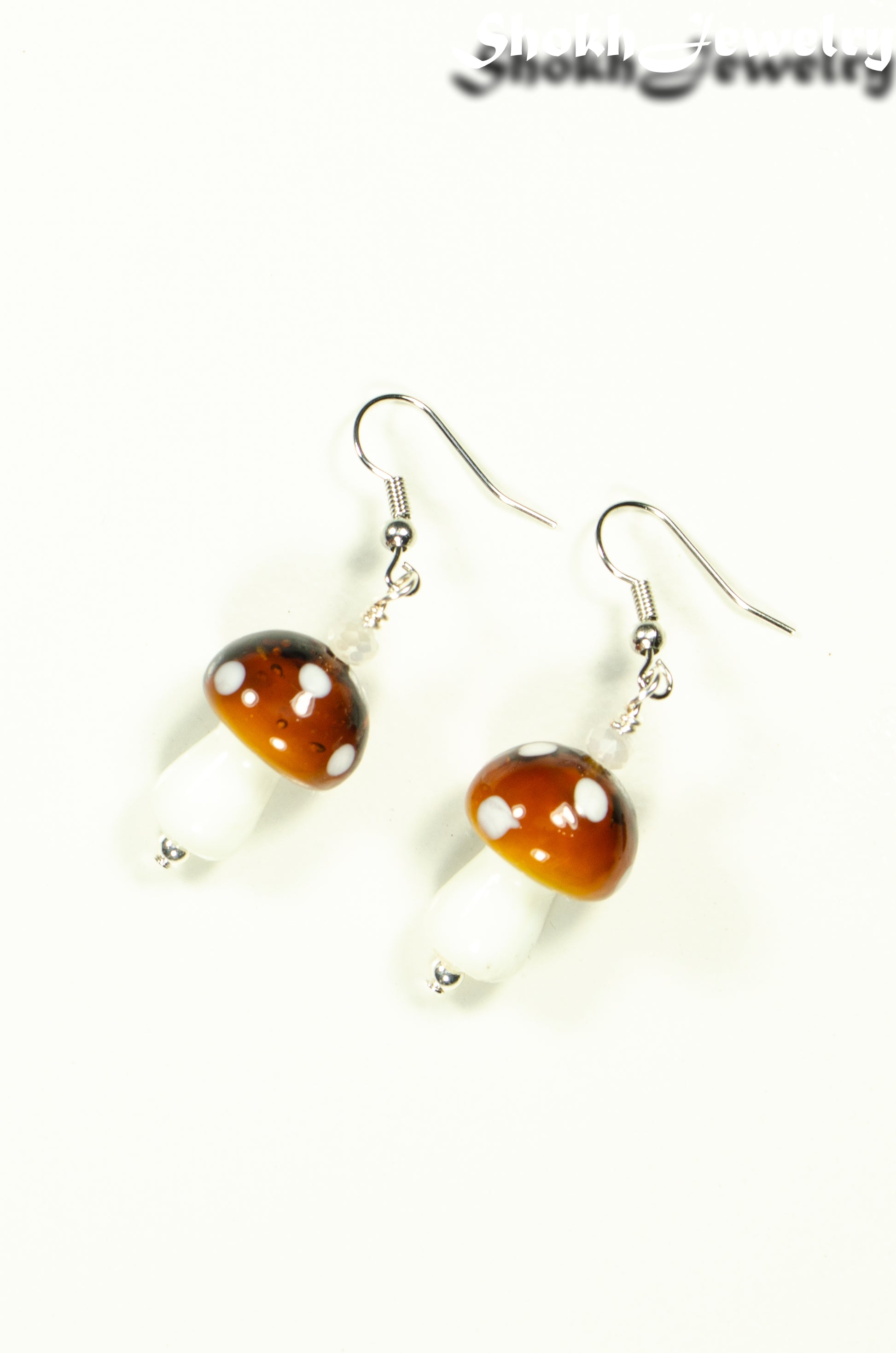 Top view of Brown Mushroom Glass Bead Earrings.