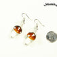 Brown Mushroom Glass Bead Earrings beside a dime.