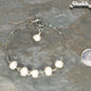 Freshwater Pearl and Stainless Steel Chain Anklet beside a dime.