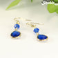 Blue Glass Teardrop Dangle Earrings with gold tone ear wires.