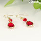 Red Glass Teardrop Dangle Earrings with gold tone ear wires.