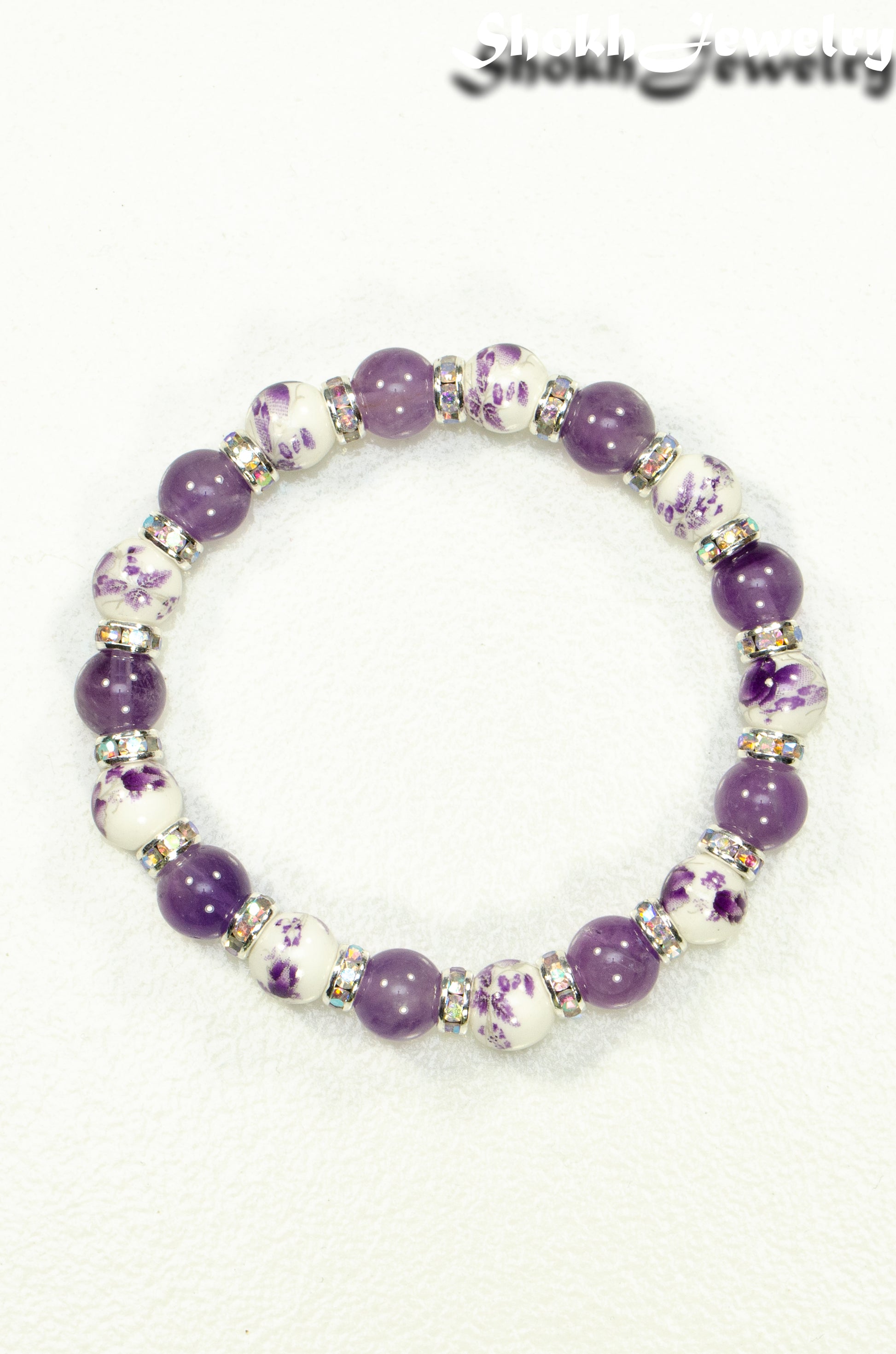 Top view of Amethyst and Purple Flower Ceramic Bead Bracelet.