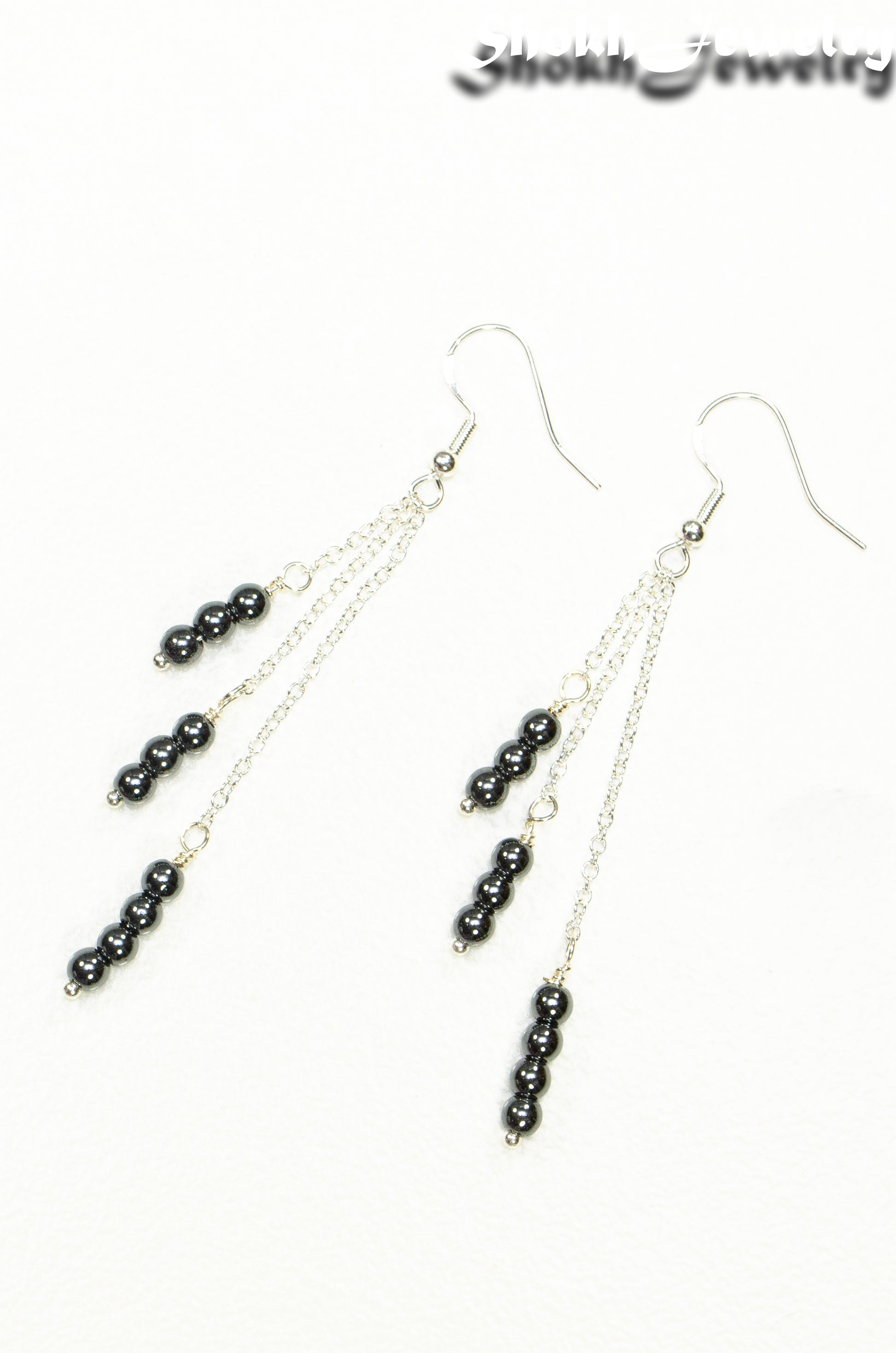 Top view of Silver Plated Chain and Natural Hematite Earrings.