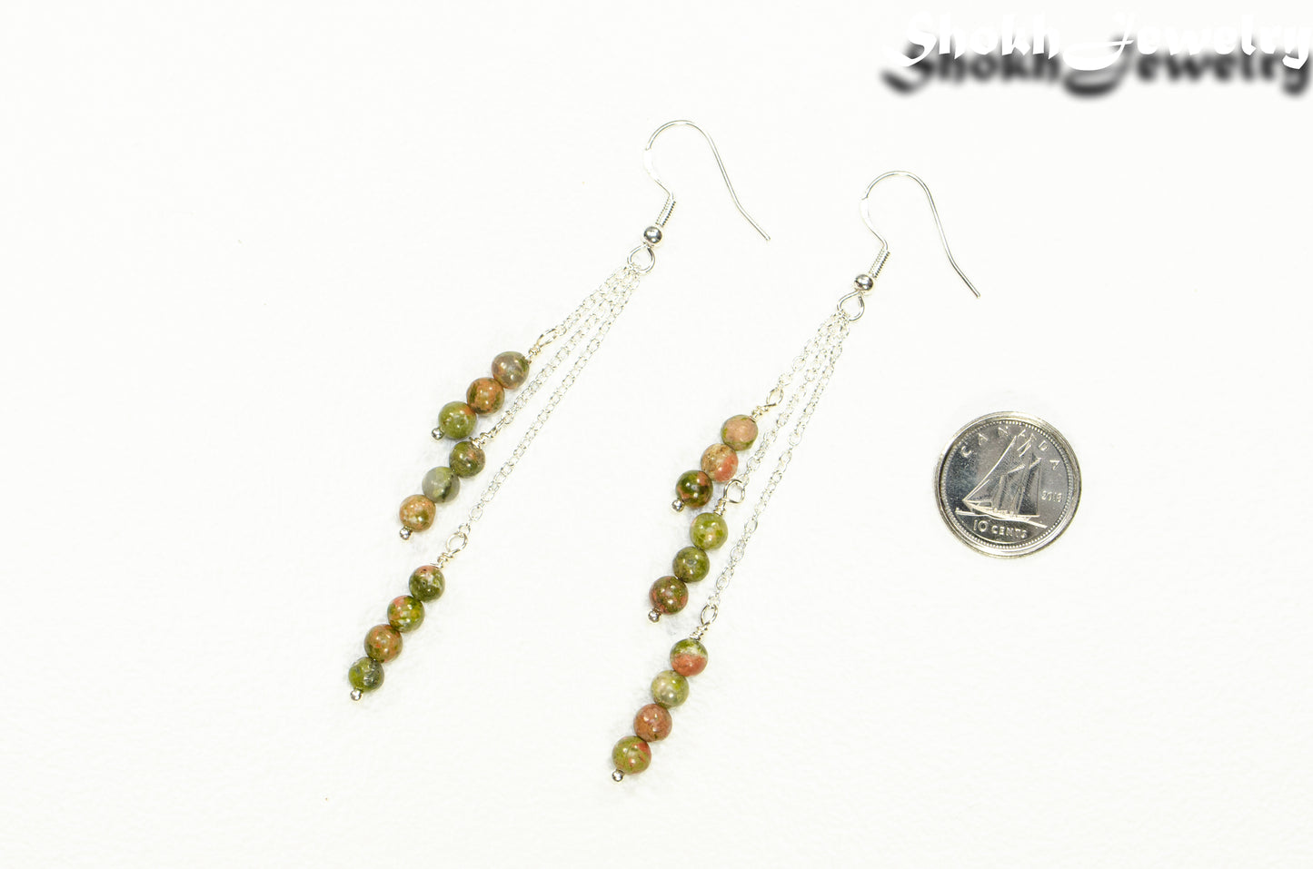 Silver Plated Chain and Unakite Stone Earrings beside a dime.