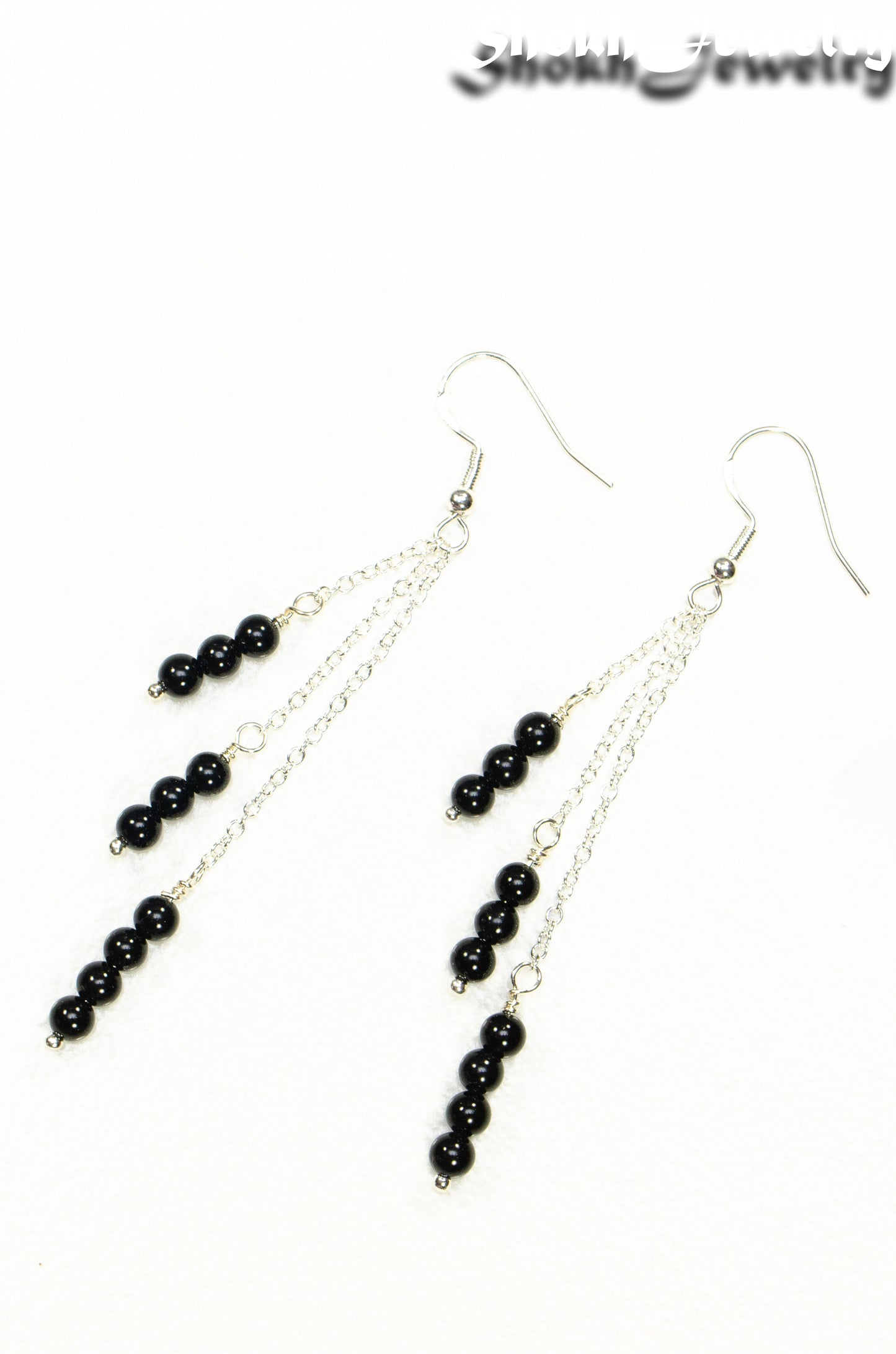 Top view of Silver Plated Chain and Black Onyx Stone Earrings.