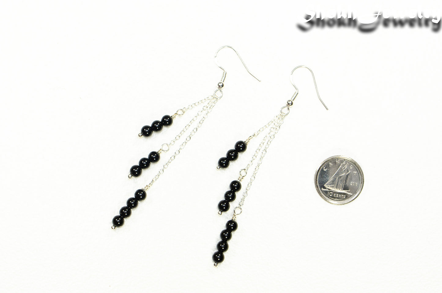 Silver Plated Chain and Black Onyx Stone Earrings beside a dime.