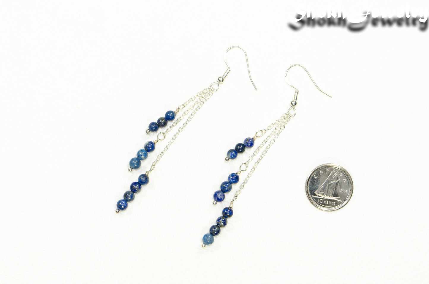 Silver Plated Chain and Lapis Lazuli Stone Earrings beside a dime.