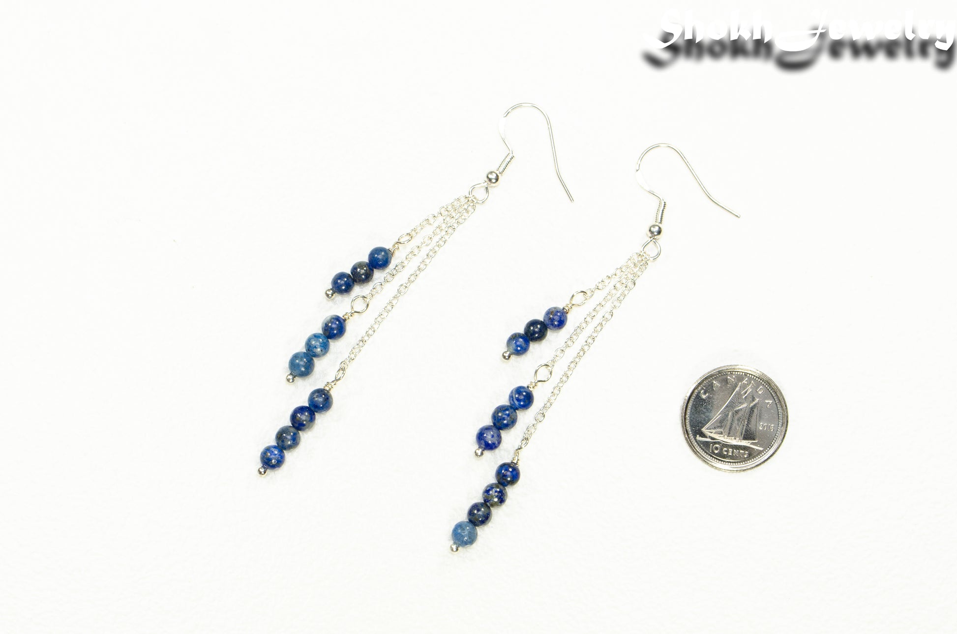 Silver Plated Chain and Lapis Lazuli Stone Earrings beside a dime.