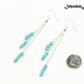 Silver Plated Chain and Turquoise Howlite Earrings beside a dime.