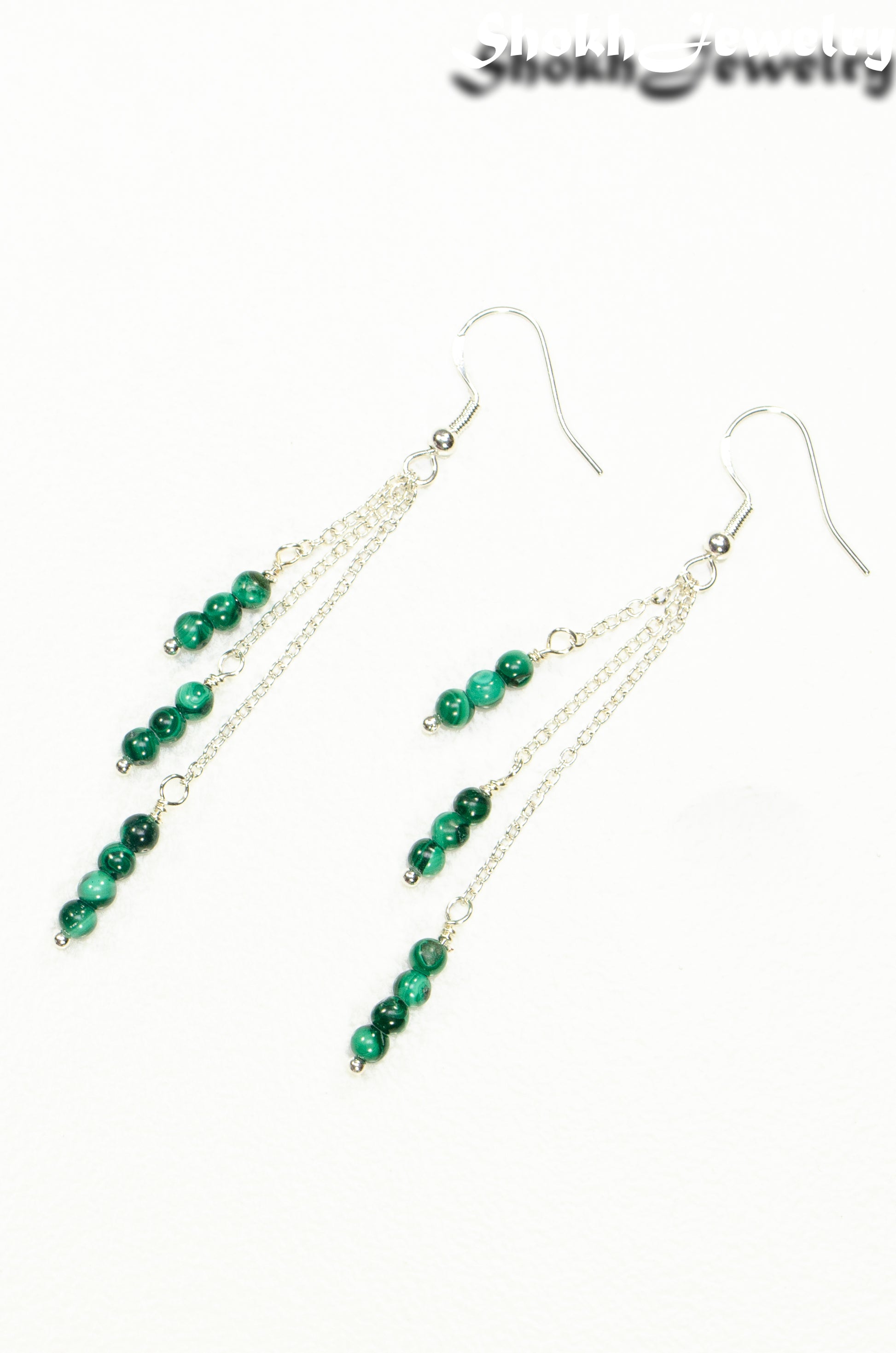 Top view of Silver Plated Chain and Malachite Stone Earrings.