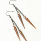 Top view of Long chain and antique copper spike earrings.