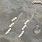 Silver Plated Chain and White Howlite Earrings beside a dime.