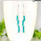 Silver Plated Chain and Turquoise Earrings displayed on a coffee mug.