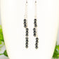 Close up of Silver Plated Chain and Natural Hematite Earrings.