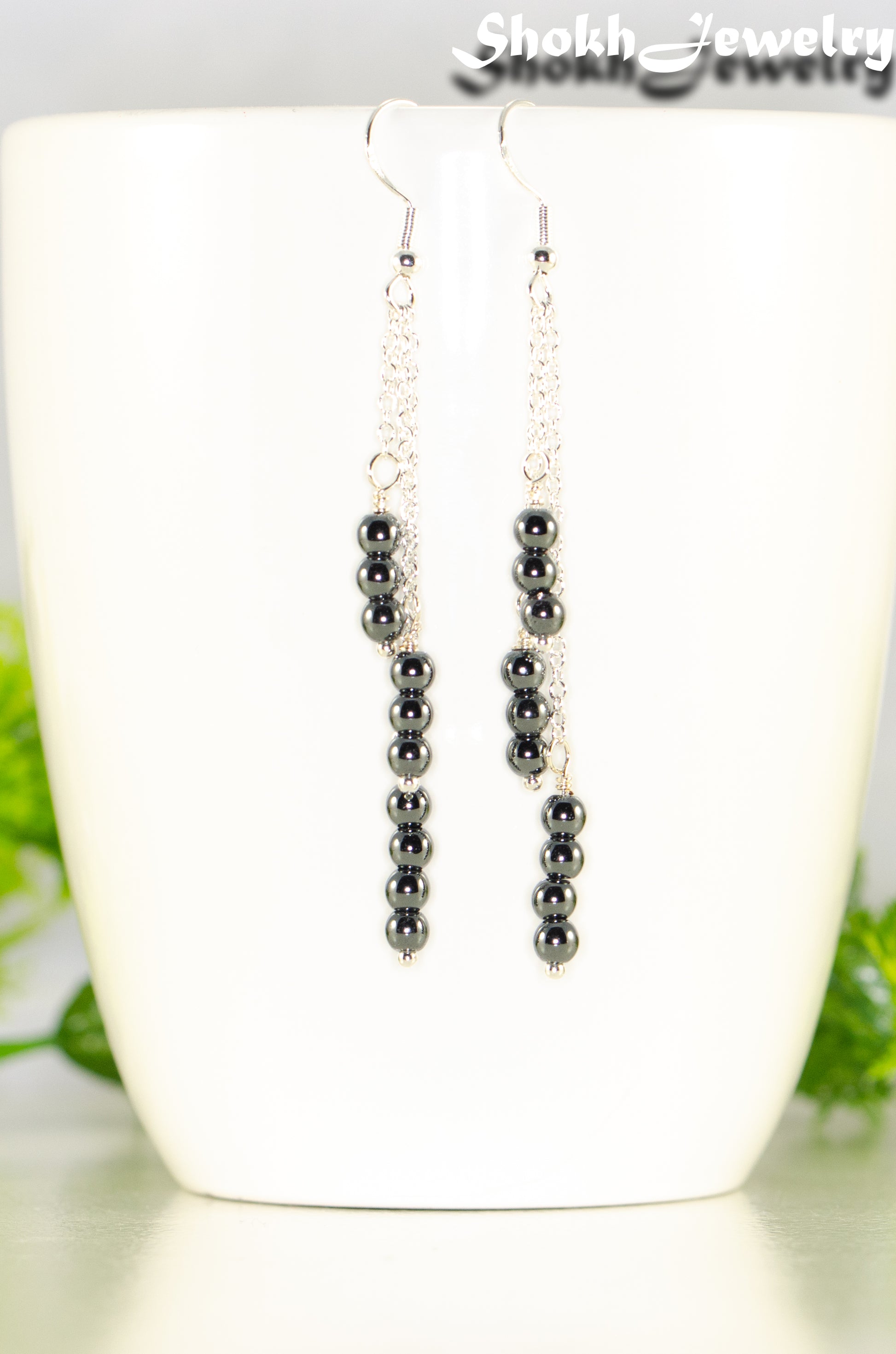 Close up of Silver Plated Chain and Natural Hematite Earrings.