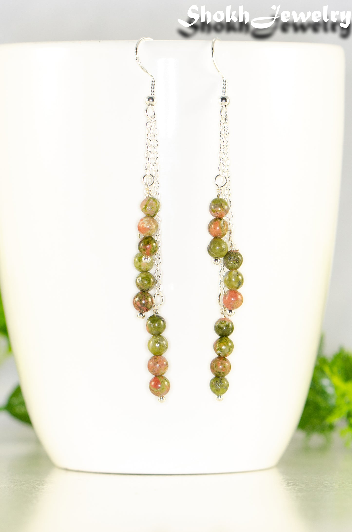 Close up of Silver Plated Chain and Unakite Stone Earrings.