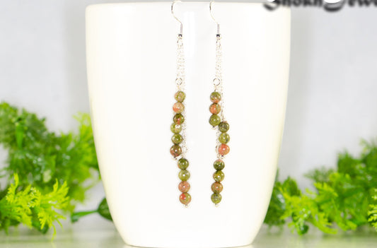 Silver Plated Chain and Unakite Stone Earrings displayed on a coffee mug.