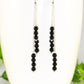 Close up of Silver Plated Chain and Black Onyx Stone Earrings.