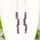 Close up of Silver Plated Chain and Amethyst Crystal Earrings.