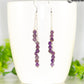 Silver Plated Chain and Amethyst Crystal Earrings displayed on a coffee mug.