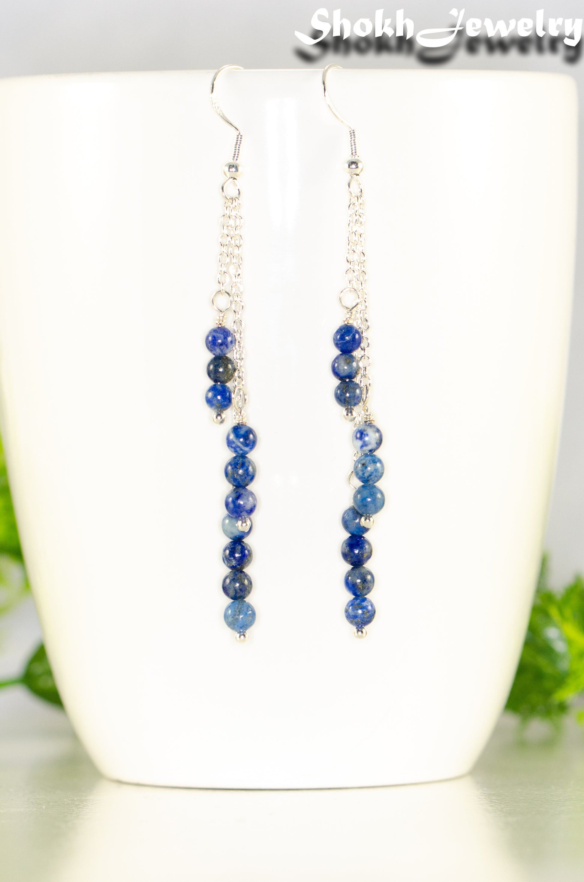 Close up of Silver Plated Chain and Lapis Lazuli Stone Earrings.