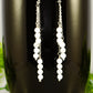 Close up of Silver Plated Chain and White Howlite Earrings.