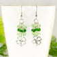 Close up of Lucky Four Leaf Clover Charm and Green Glass Bead Earrings.