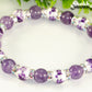 Close up of Amethyst and Purple Flower Ceramic Bead Bracelet.