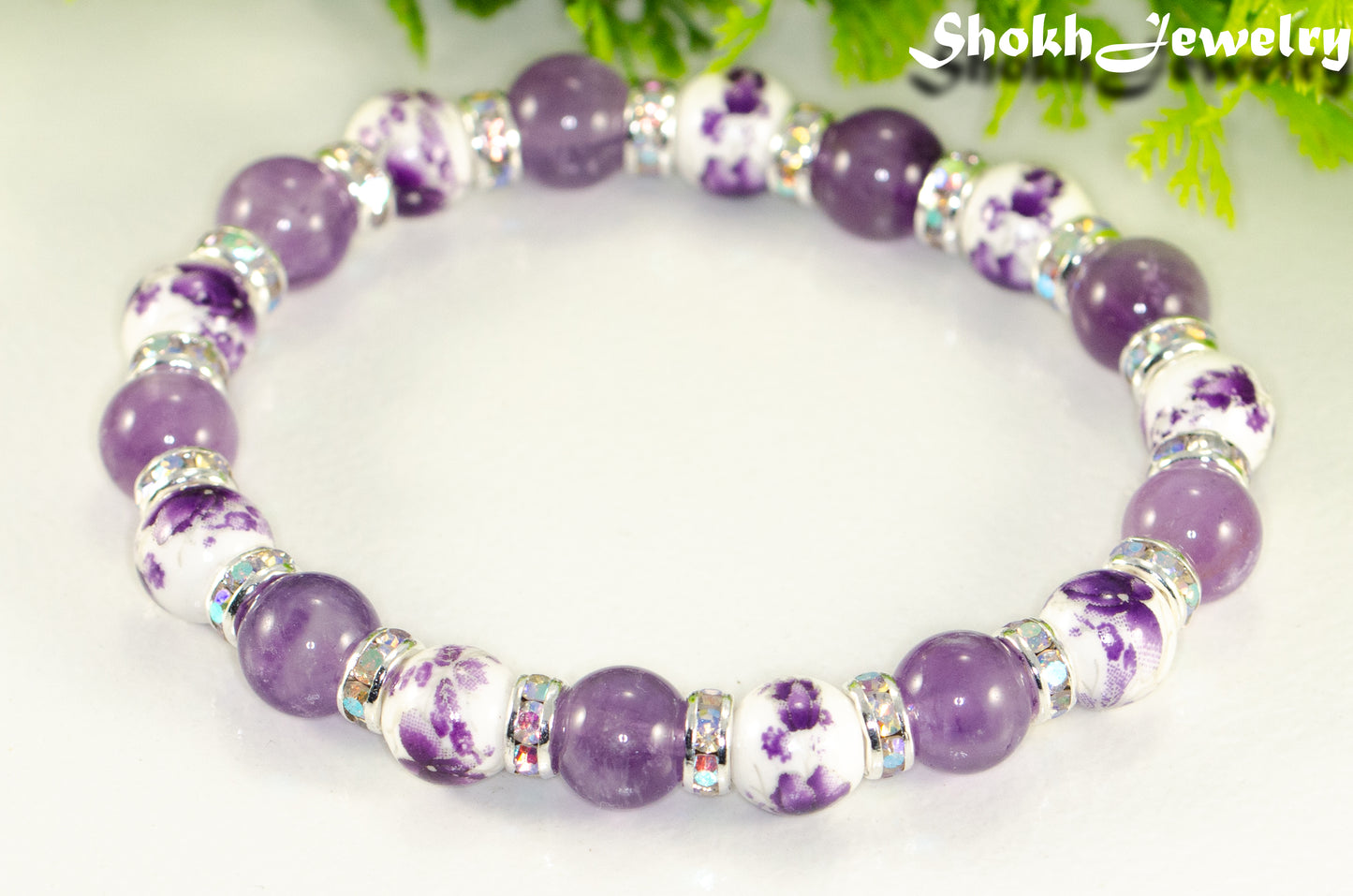 Close up of Amethyst and Purple Flower Ceramic Bead Bracelet.