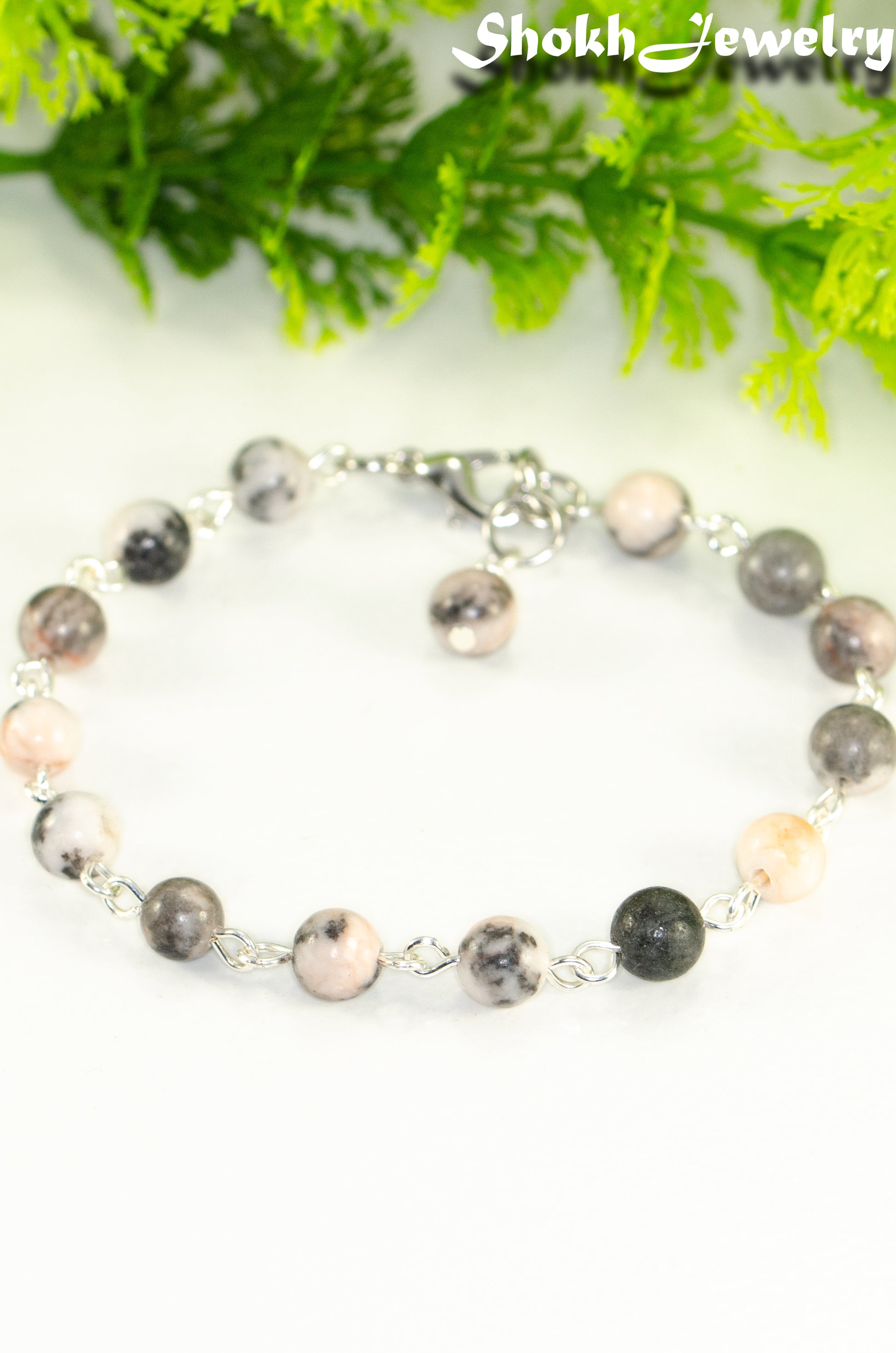 Close up of Handmade Pink Zebra Jasper Link Bracelet.