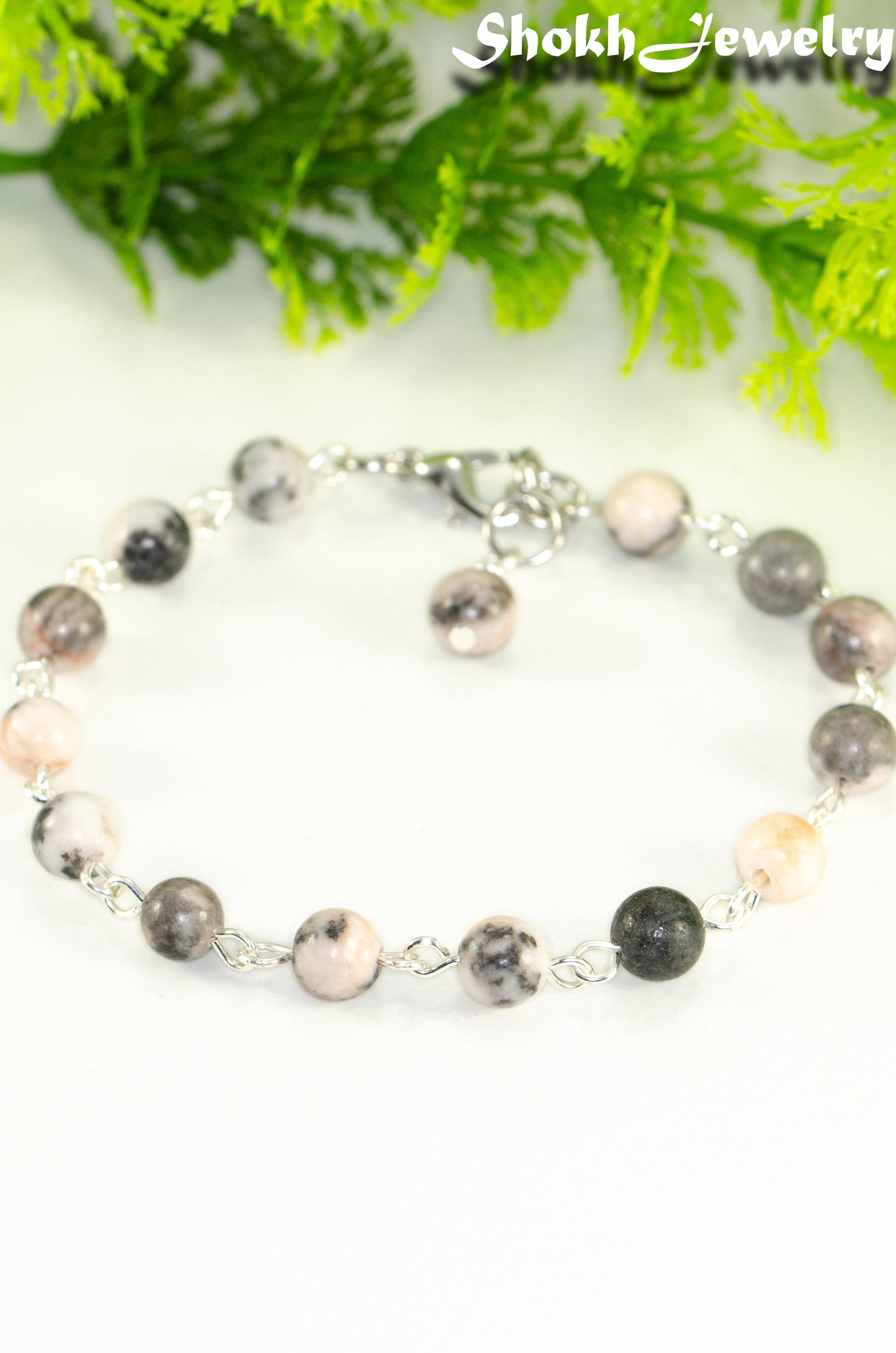 Close up of Handmade Pink Zebra Jasper Link chain anklet.