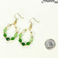 Ombre Green Glass Crystal Hoop Earrings beside a dime.